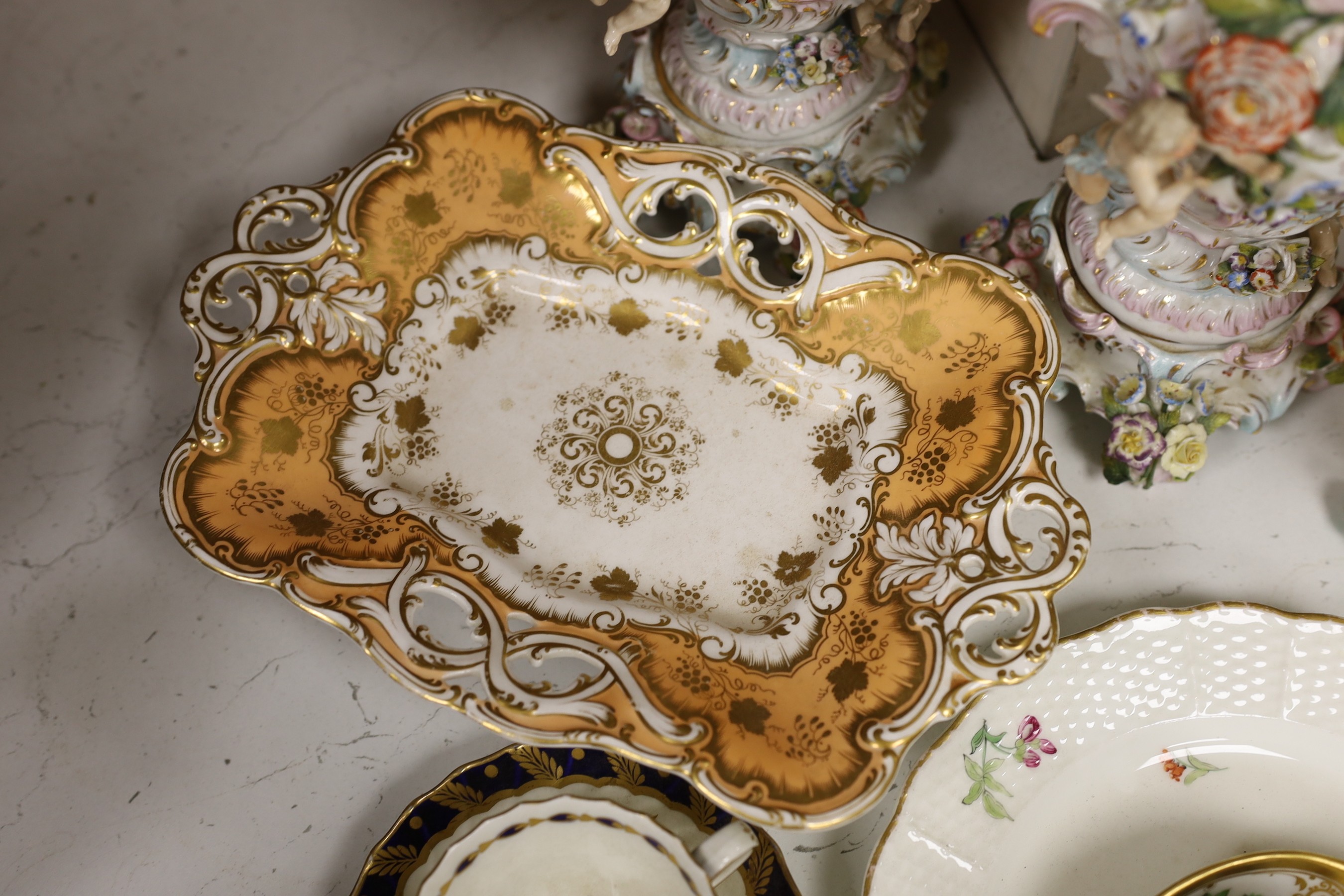 A mixed collection of floral encrusted 19th century and later Continental porcelain